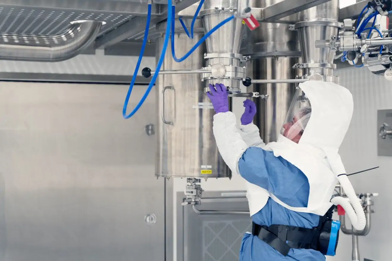 women working on spray dryer