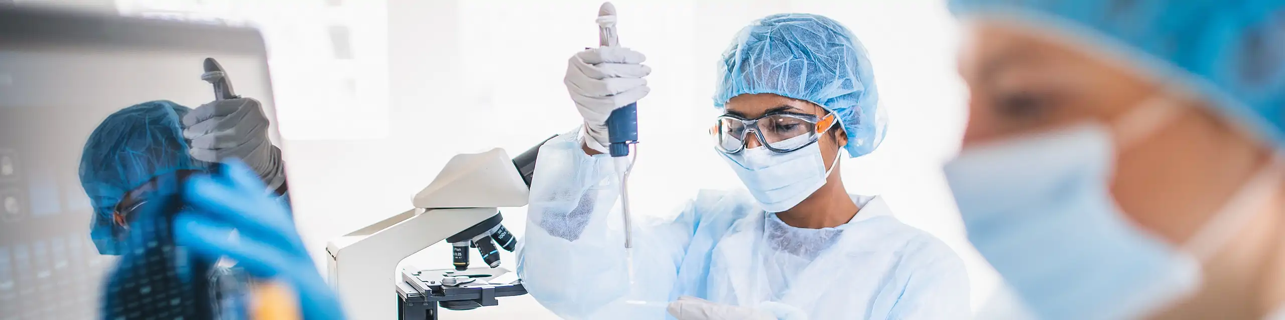 Scientists wearing full protective suit working in the laboratory 