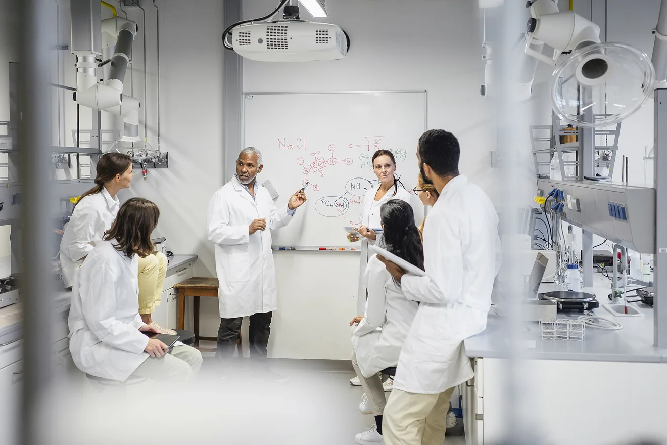 Scientist in lab meeting 